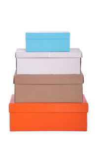 stack of colorful boxes used for spring organization and cleaning