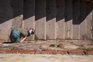 licensed mold remediation contractor working on moldy drywall
