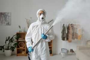 professional crime scene cleanup biohazard technician full PPE trauma scene