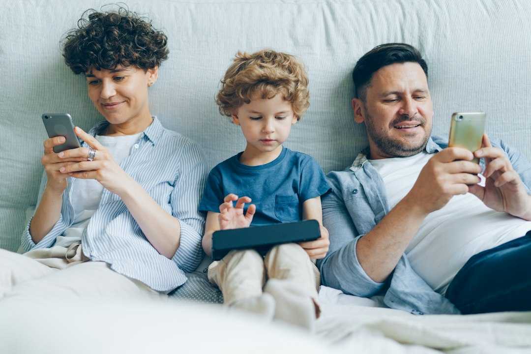 family listening to a podcast together